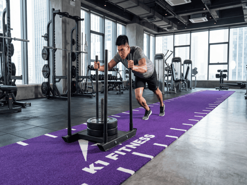 Custom gym turf with inlaid logo and speed ladder
